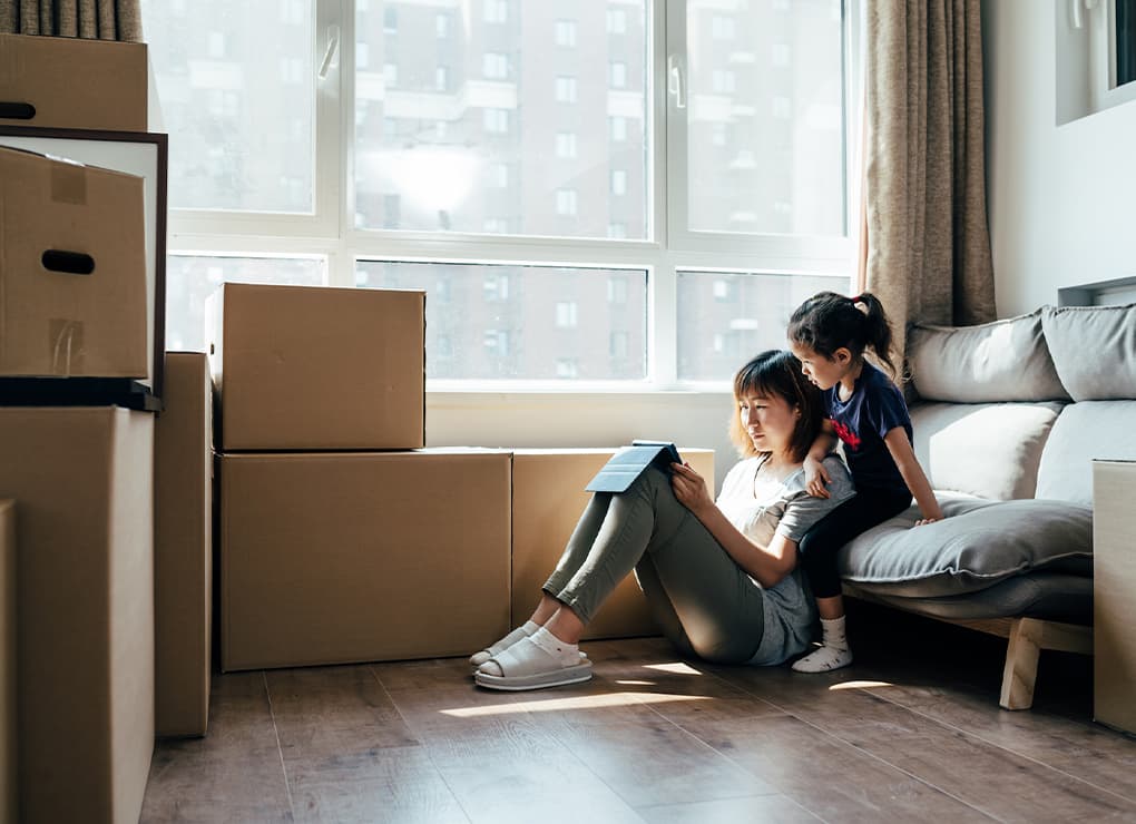 Maid-Bright-Professional-House-Cleaning-Service-Moving-Cleaning-Woman-and-Child-Moving-Boxes